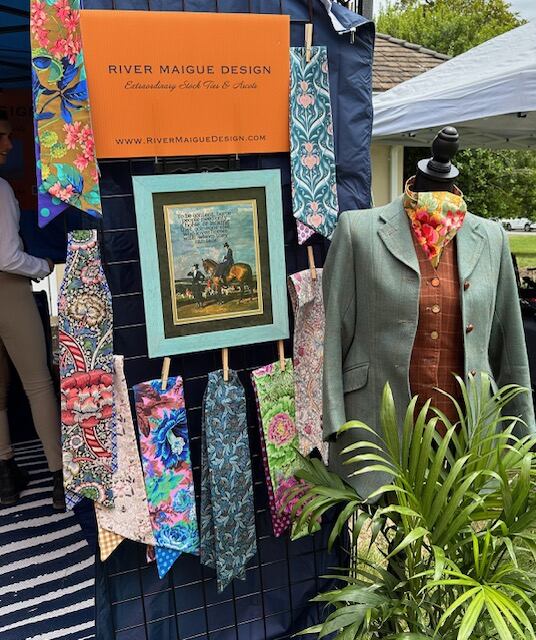 River Maigue Design stock ties displayed with hunt coat outside booth at hound show